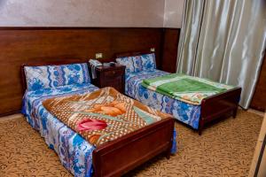 Cama o camas de una habitación en AL Tayser Hotel