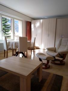 a living room with a table and a dining room at Utoring 322 in Leukerbad