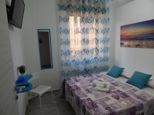 Postel nebo postele na pokoji v ubytování B&B 36 Passi dal Mare