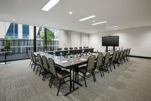 a large conference room with a long table and chairs at Quest Notting Hill in Clayton North