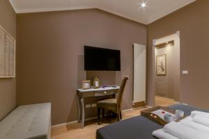 a hotel room with a desk and a bed at 051 Boutique in Bologna