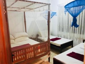 a room with two bunk beds and a room with at Weligama Villa South in Weligama