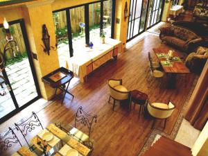 a living room with a couch and a table and chairs at Posia 122 in Tainan