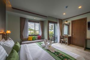 Postel nebo postele na pokoji v ubytování Andaman Breeze Resort