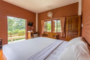 Postel nebo postele na pokoji v ubytování Saen Kam Resort