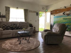 Posezení v ubytování beach house Cg7p