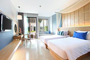 Postel nebo postele na pokoji v ubytování CRAFT Resort & Villas, Phuket Town