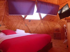 Llit o llits en una habitació de Dune & Domes Pichilemu