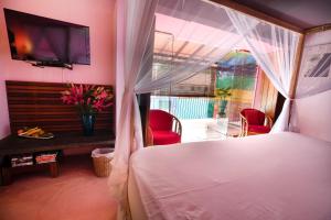 Voodi või voodid majutusasutuse Dickman Resort "The Boutique Hotel" toas