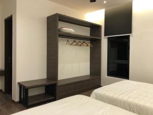 Ένα ή περισσότερα κρεβάτια σε δωμάτιο στο The Dahlias at Afamosa Melaka