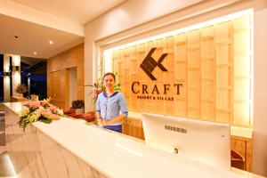 a woman standing in front of a craft store at CRAFT Resort & Villas, Phuket Town in Phuket Town