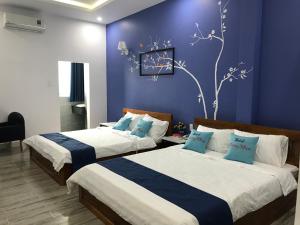 Tempat tidur dalam kamar di Khách sạn Đăng Khoa