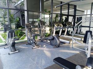 a gym with a bunch of cardio machines at Georgetown SeaView Condo Tropicana 218 Macalister in George Town