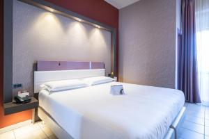 Postel nebo postele na pokoji v ubytování Hotel Palace