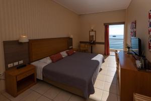 Ένα ή περισσότερα κρεβάτια σε δωμάτιο στο Ξενοδοχείο Όστρια