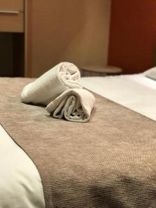 Postel nebo postele na pokoji v ubytování Hotel de Bretagne