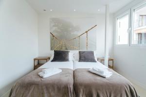 A bed or beds in a room at Preciosas Vistas a Catedral