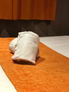 Postel nebo postele na pokoji v ubytování Hotel de Bretagne