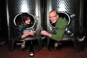 a man and a woman sitting at a table with wine glasses at Weingut Hirschen Enkircherweg in Burg an der Mosel +29 photos