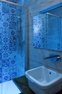 a bathroom with a tub and a sink and a shower at Acquasalata in Salerno +82 photos