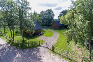an aerial view of two cabins with a fence at Paekalda Holiday Centre in Rummu