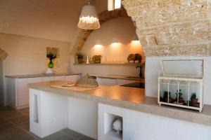 A kitchen or kitchenette at Dimora Sighé, exclusive rural villa with hydromassage pool