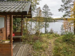 a cabin with a view of a lake at Holiday Home Etelärinne by Interhome in Vuoriniemi +19 photos