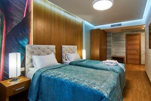 Postel nebo postele na pokoji v ubytování Light Hotel