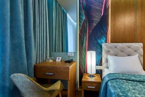 Postel nebo postele na pokoji v ubytování Light Hotel