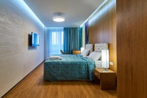 Postel nebo postele na pokoji v ubytování Light Hotel