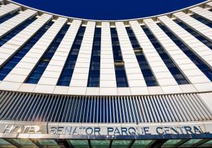 a large building with a clock on the front of it at Senator Parque Central Hotel in Valencia