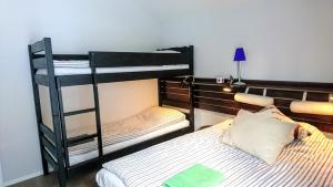 a bedroom with two bunk beds and a bed at Chalet Taube in Bad Gastein