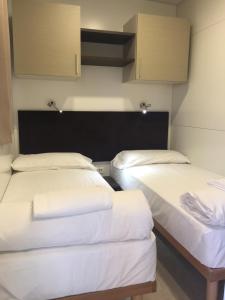 Posteľ alebo postele v izbe v ubytovaní Camping Venezia Village