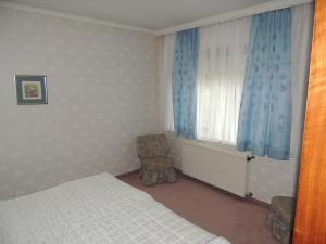 Postel nebo postele na pokoji v ubytování Appartement Eva