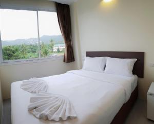 Ένα ή περισσότερα κρεβάτια σε δωμάτιο στο Top Hostel Samui