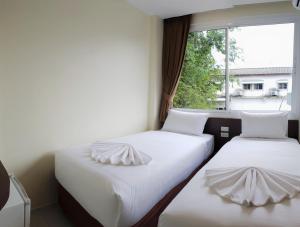 Postel nebo postele na pokoji v ubytování Top Hostel Samui