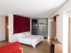 Postel nebo postele na pokoji v ubytování Hospedium Hotel Cañitas Maite Boutique