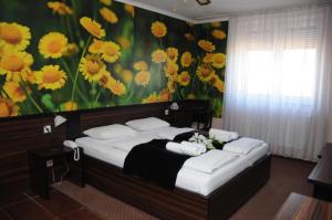 Säng eller sängar i ett rum på Green Hotel Budapest
