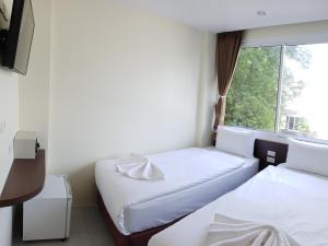 Ένα ή περισσότερα κρεβάτια σε δωμάτιο στο Top Hostel Samui