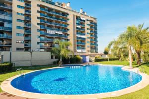 a large swimming pool in front of a building at Playa & Golf in Alicante