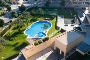 an overhead view of a swimming pool on top of a building at Playa & Golf in Alicante