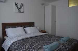 Postel nebo postele na pokoji v ubytování Enka apartmani