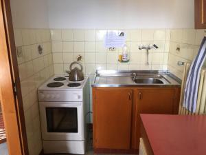 Kuchyň nebo kuchyňský kout v ubytování Hôtel Ecureuil Villars + 37 fotografií