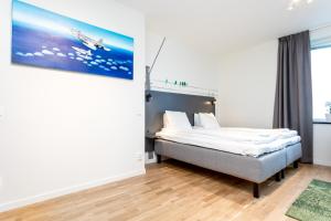 Letto o letti in una camera di ApartDirect Linköping Arena