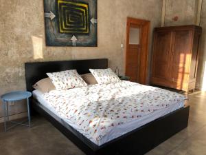a bedroom with a large bed with a white comforter at Apartmány 83 in Horní Maršov