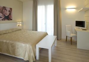 Posteľ alebo postele v izbe v ubytovaní Hotel Vienna