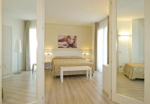 Posteľ alebo postele v izbe v ubytovaní Hotel Vienna