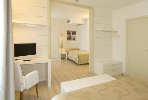 Posteľ alebo postele v izbe v ubytovaní Hotel Vienna