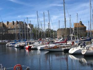 a bunch of boats docked in a marina at Emeraude, pleine vue de mer in Saint Malo