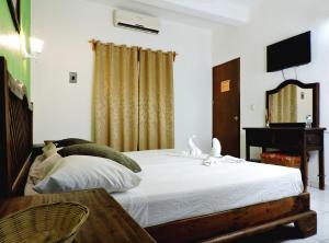 Cama o camas de una habitación en Hotel Valladolid